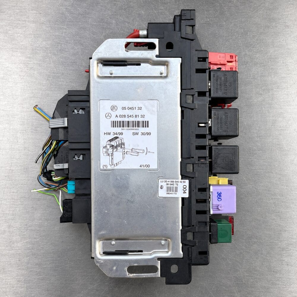 Used Mercedes-Benz SAM module A 028 545 81 32 for 2003 S500 and S55 AMG on a silver gray background